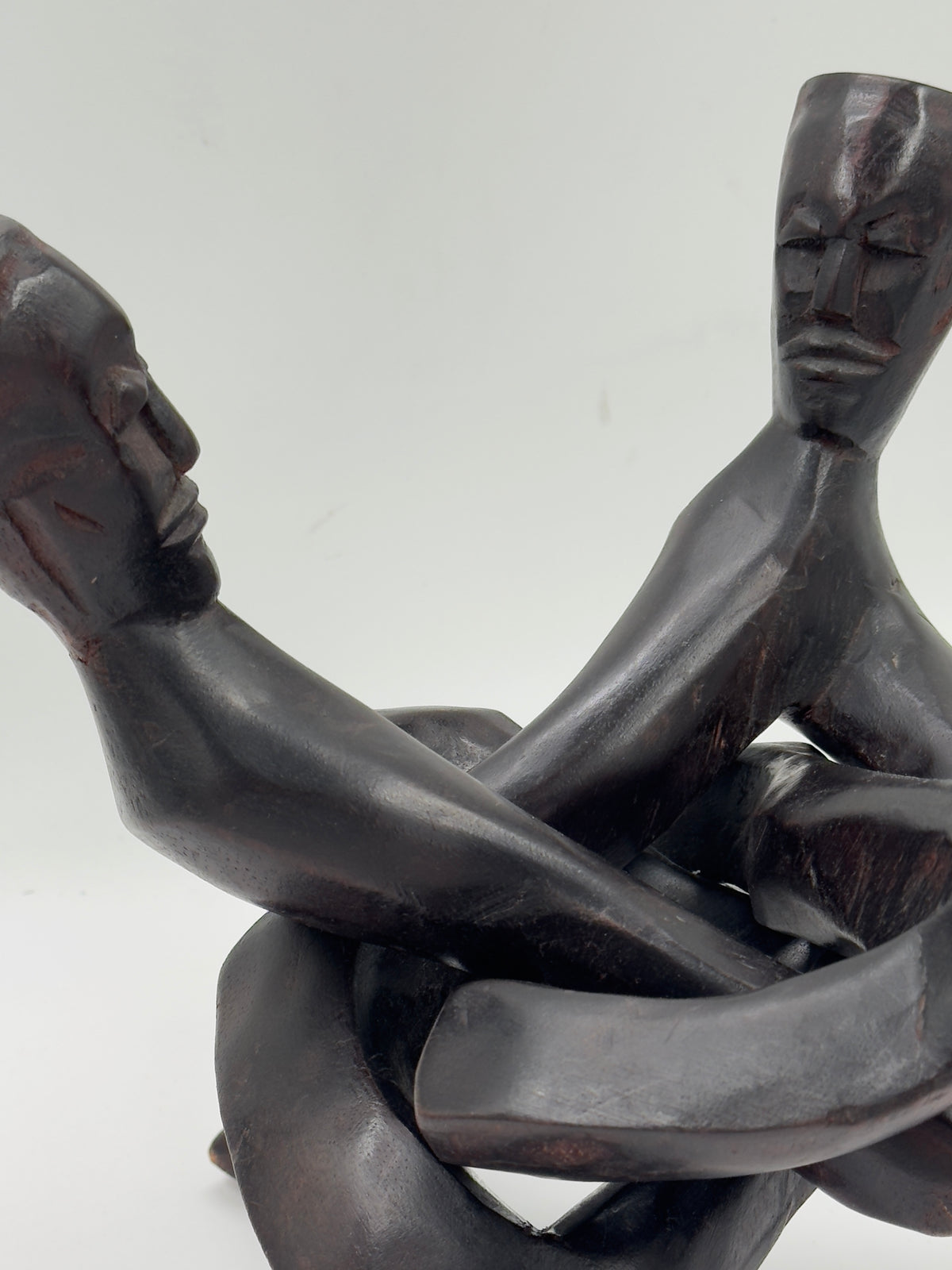 Hand-Carved Wood Sculpture of Three Interlocked Figures