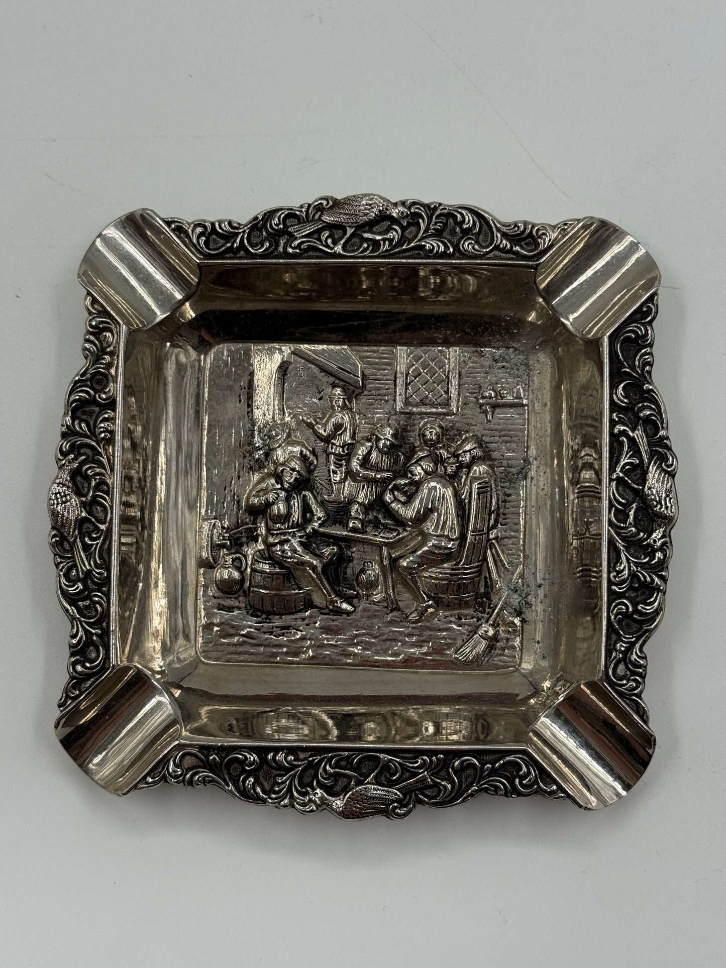 Vintage silver-plated ashtray with tavern scene relief