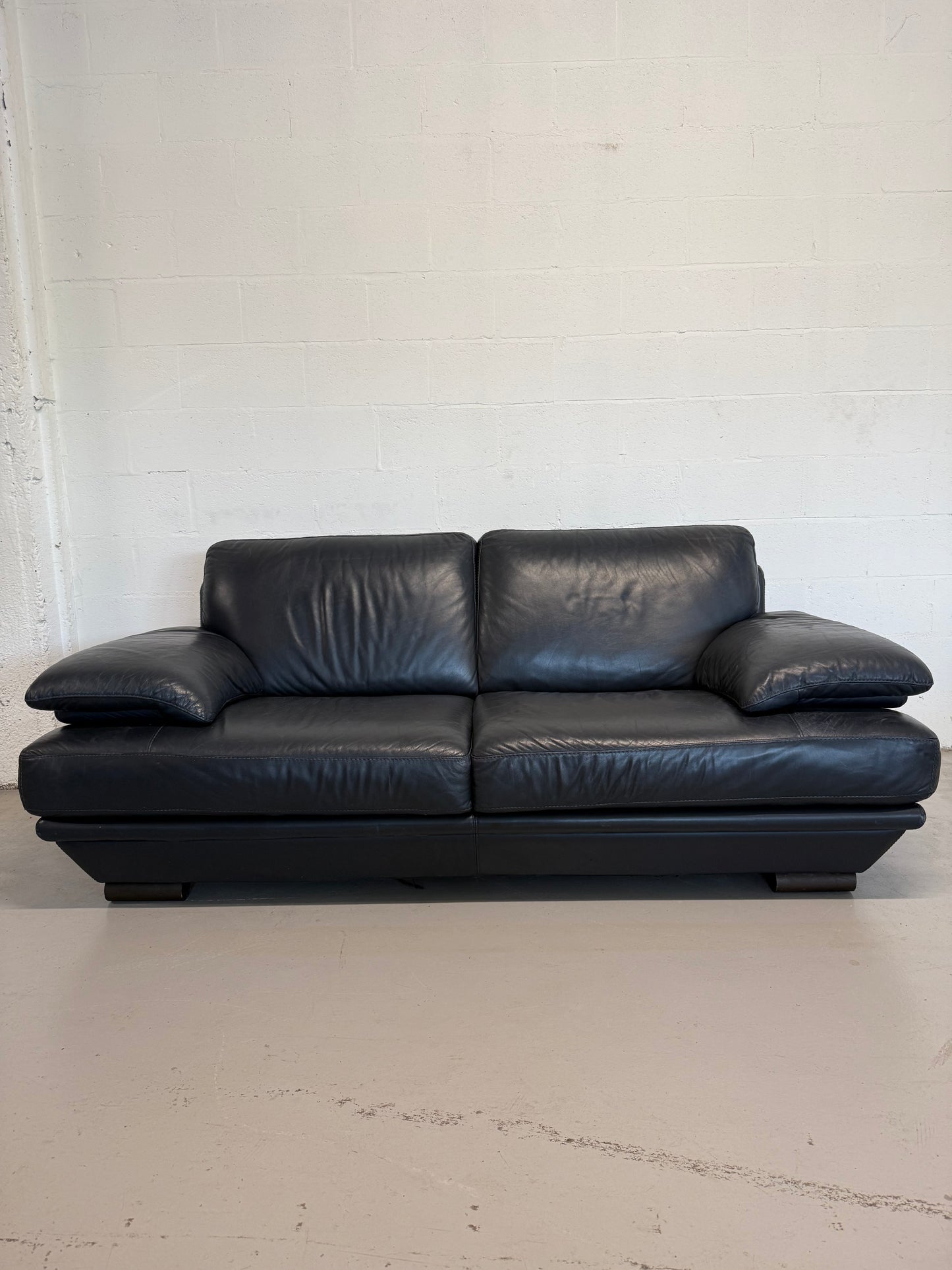 Natuzzi navy blue leather 2-seater sofa