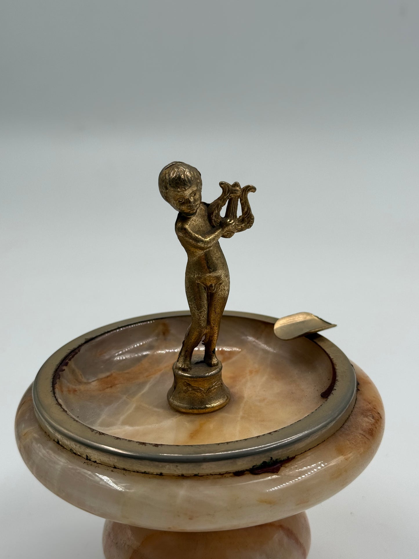 Vintage onyx ashtray with brass cherub figure