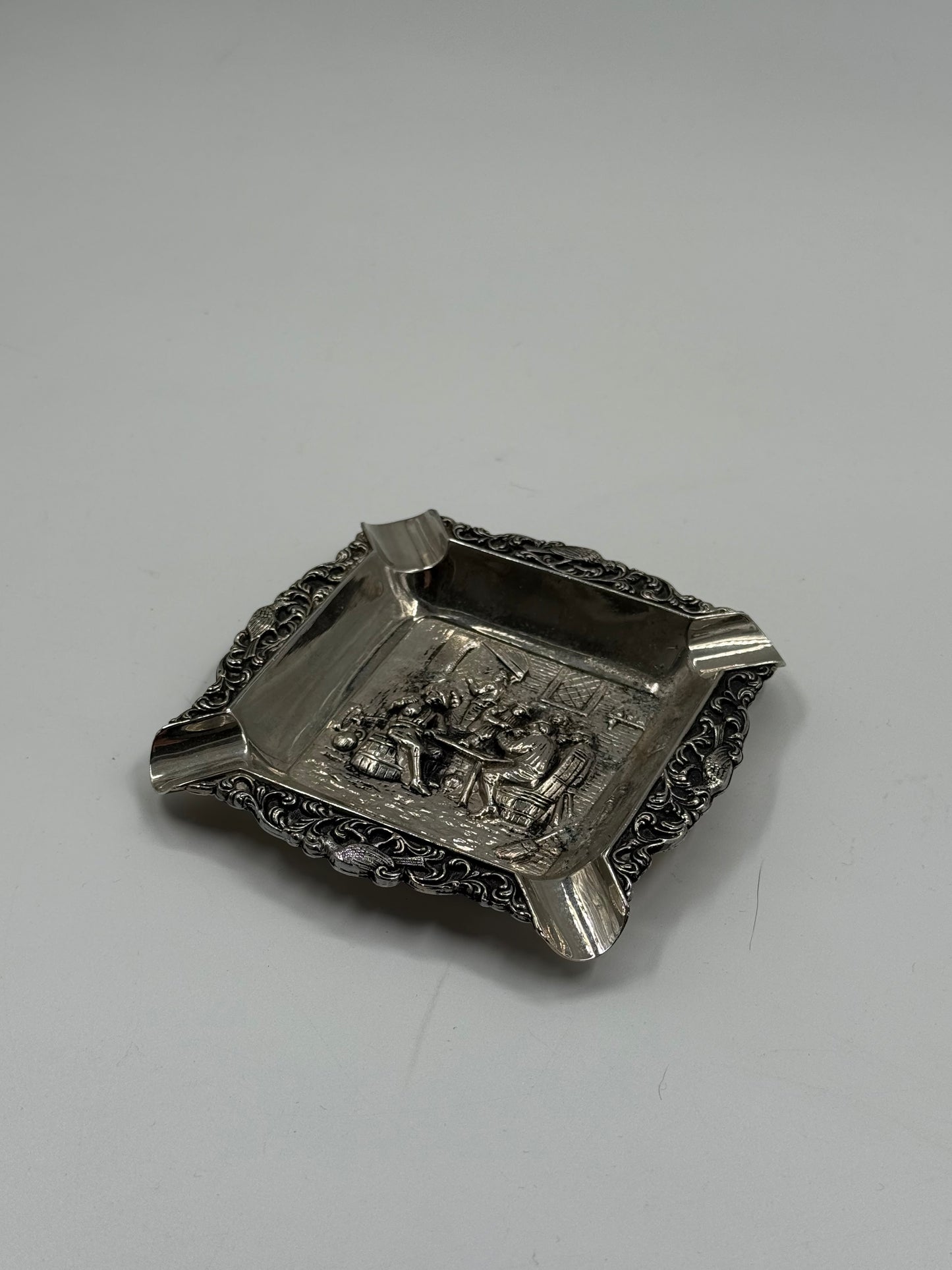 Vintage silver-plated ashtray with tavern scene relief