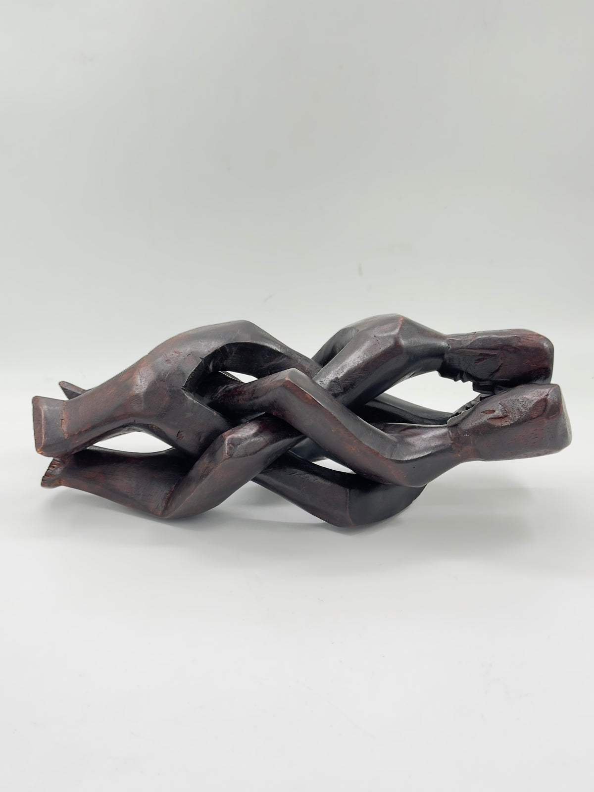 Hand-Carved Wood Sculpture of Three Interlocked Figures
