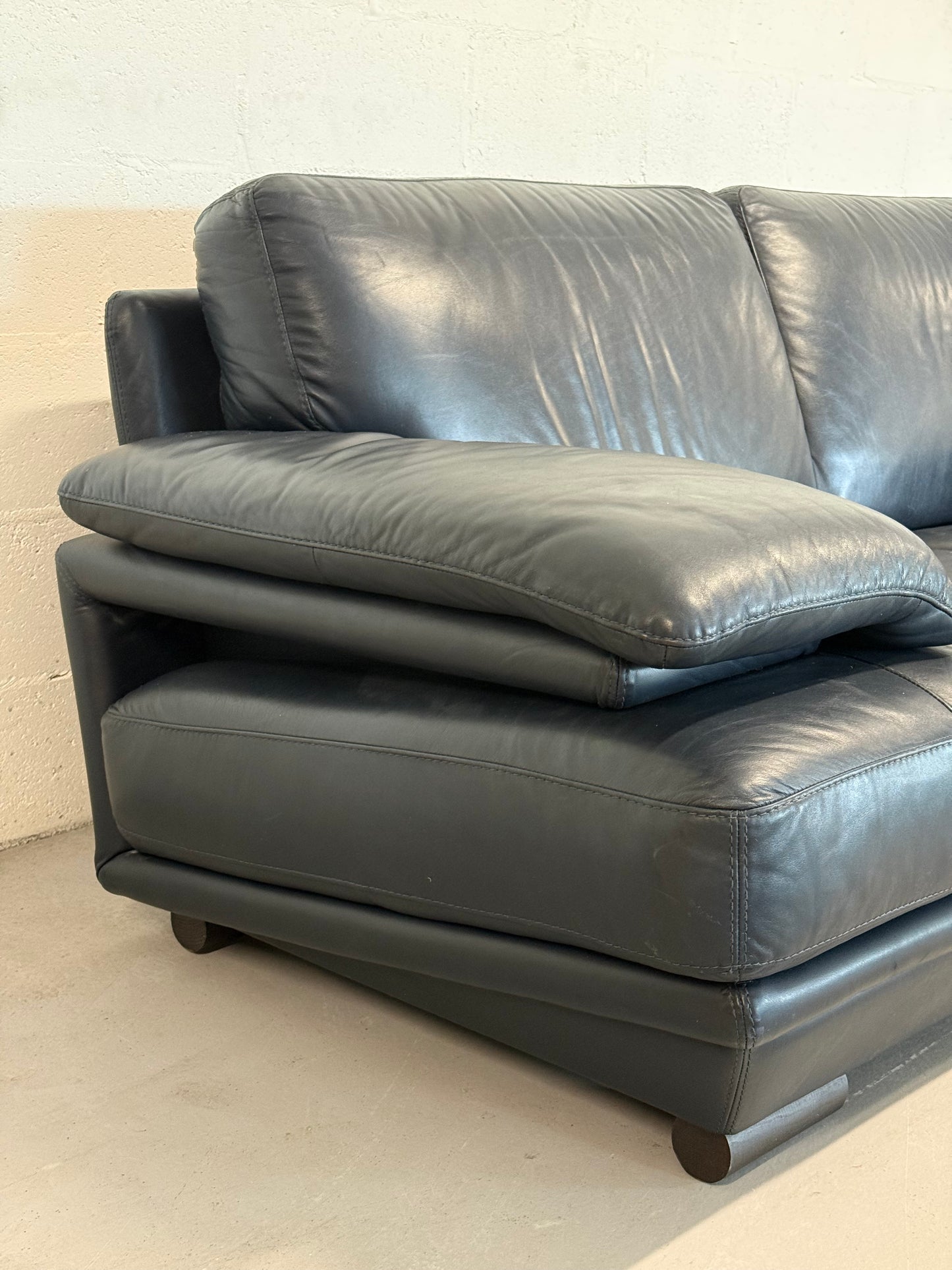 Natuzzi navy blue leather 2-seater sofa