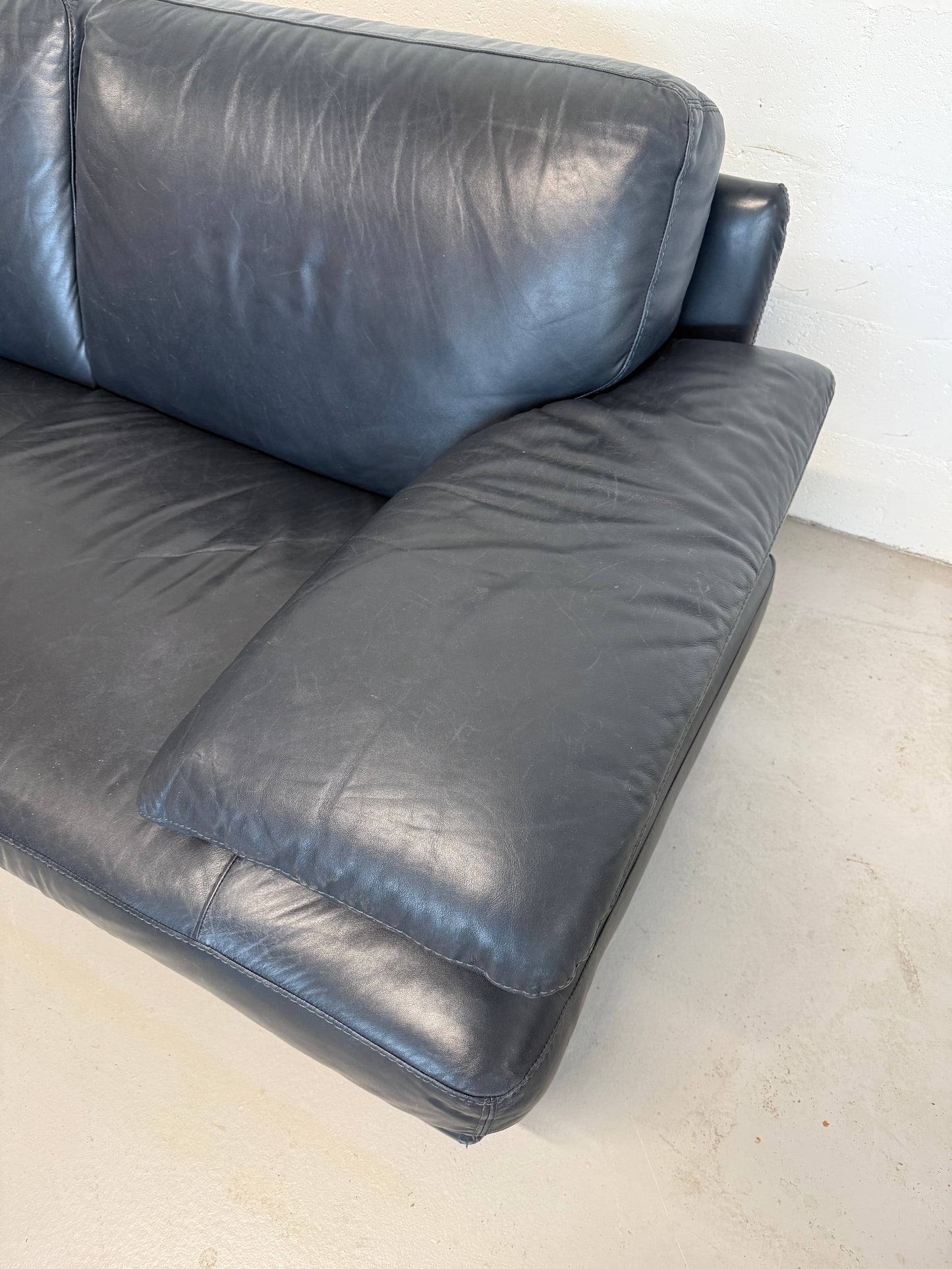 Natuzzi navy blue leather 2-seater sofa