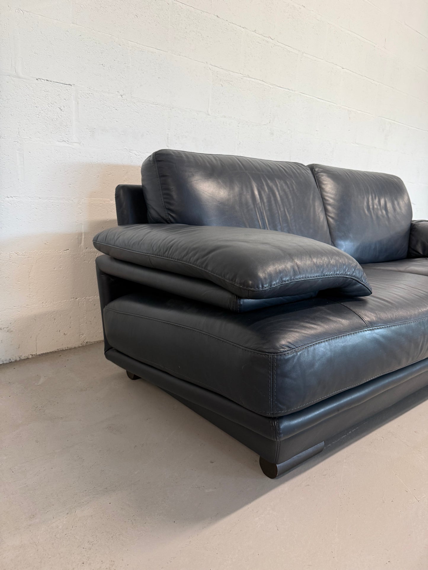 Natuzzi navy blue leather 2-seater sofa