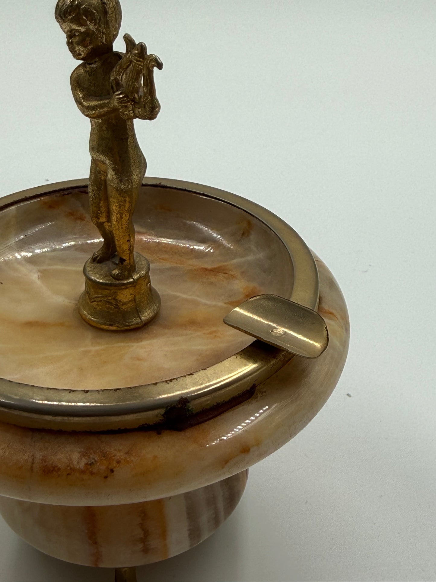 Vintage onyx ashtray with brass cherub figure