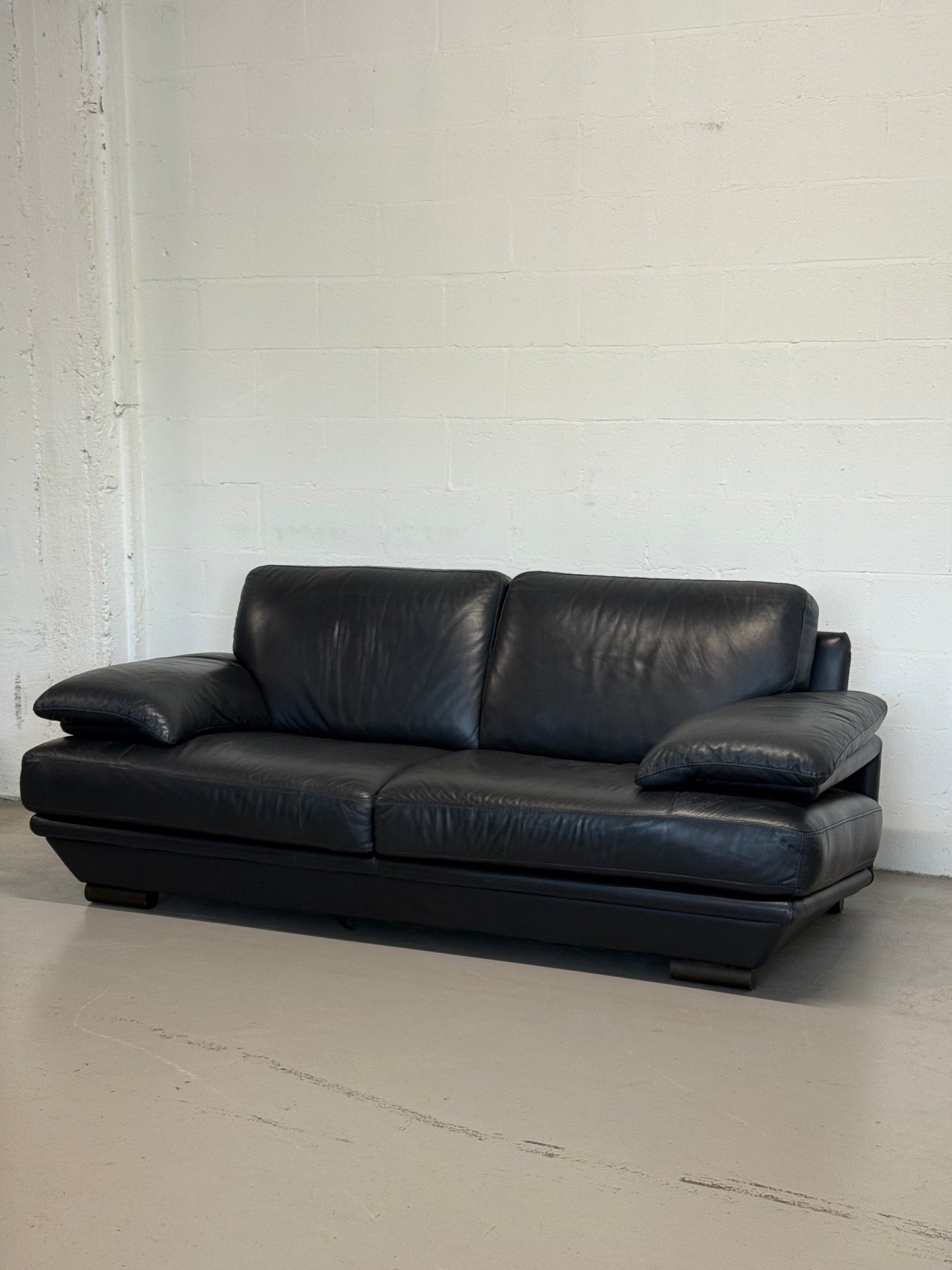 Natuzzi navy blue leather 2-seater sofa