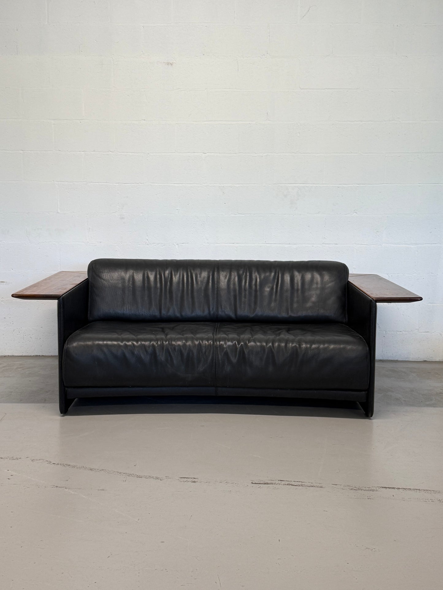 Vintage Black Leather Loveseat with Cantilevered Walnut Tray Arms
