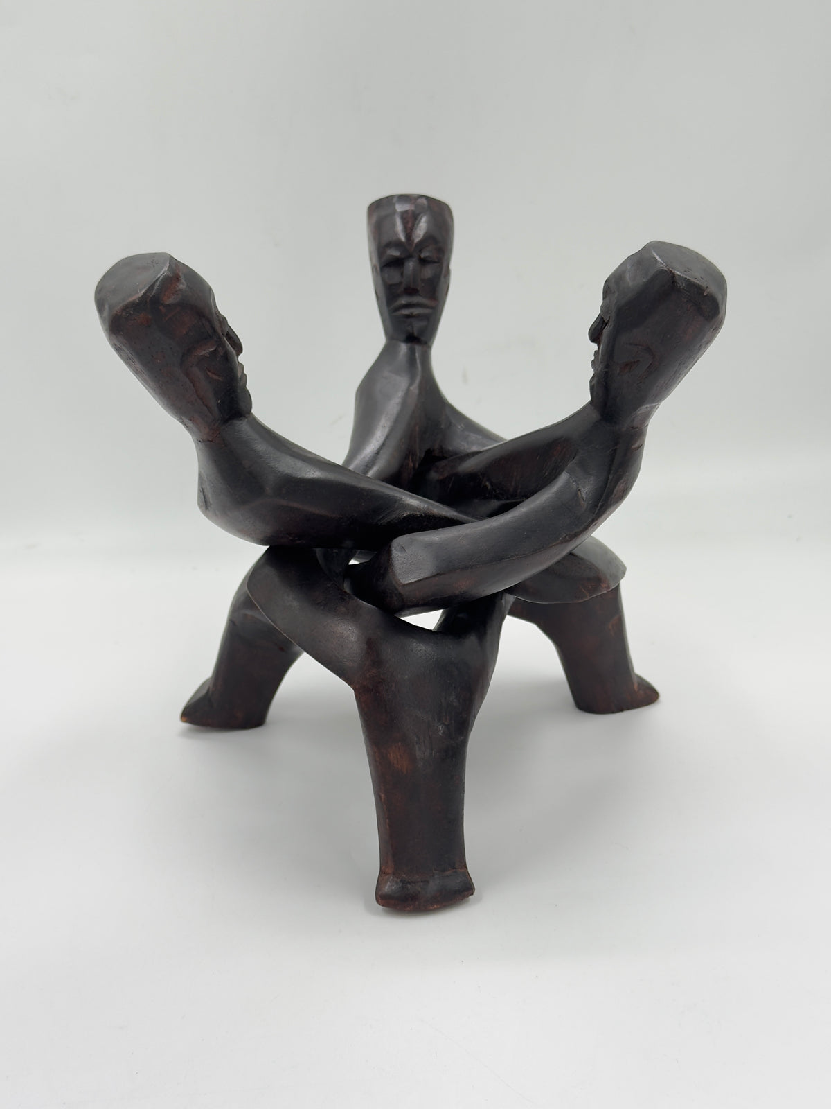 Hand-Carved Wood Sculpture of Three Interlocked Figures