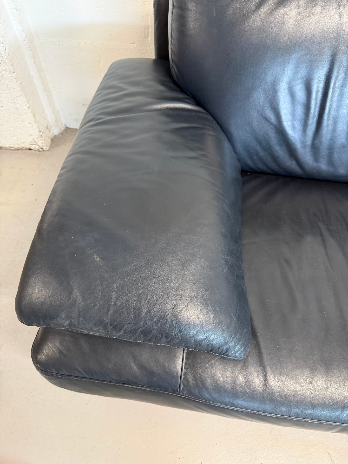Natuzzi navy blue leather 2-seater sofa