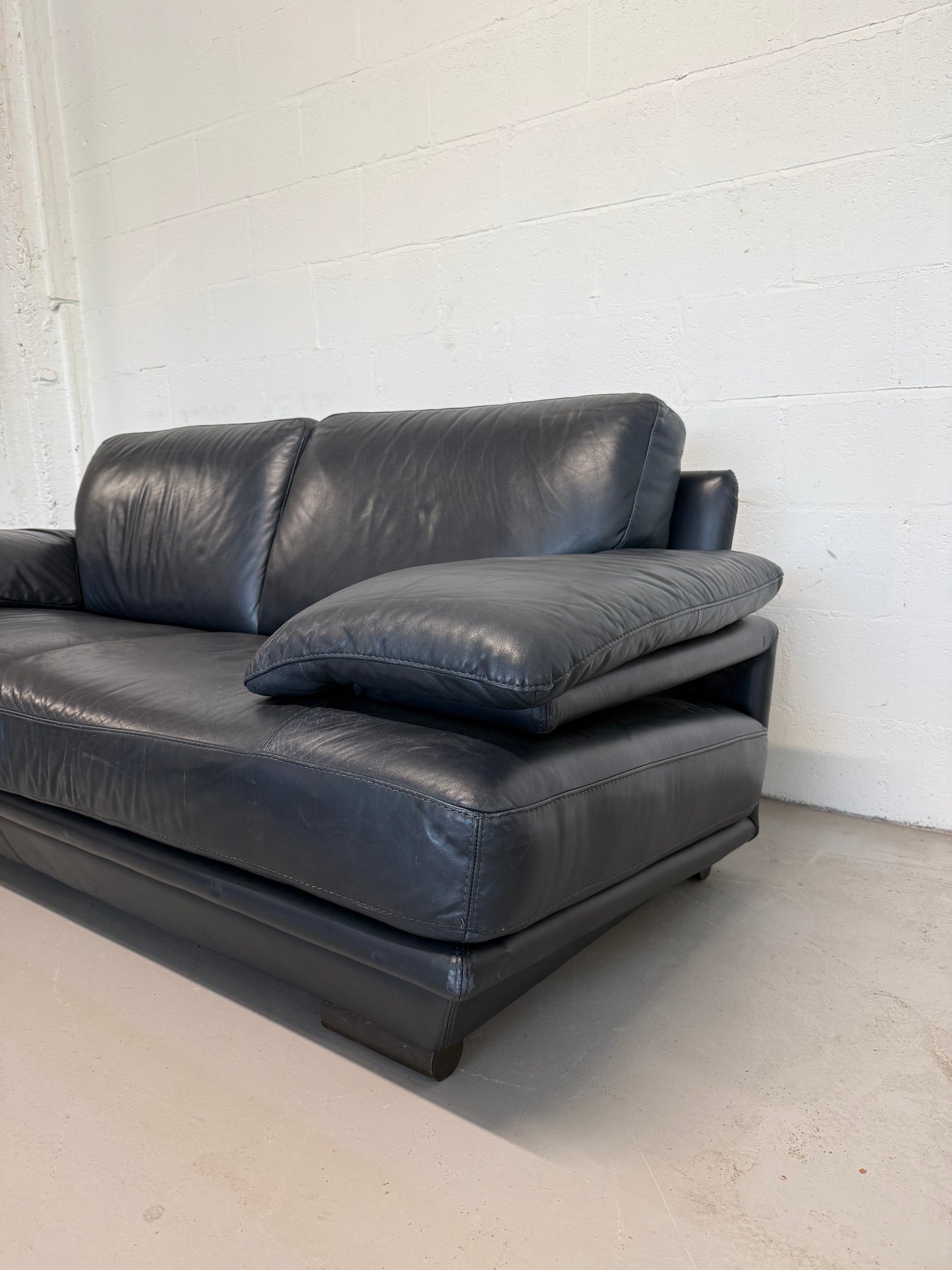 Natuzzi navy blue leather 2-seater sofa