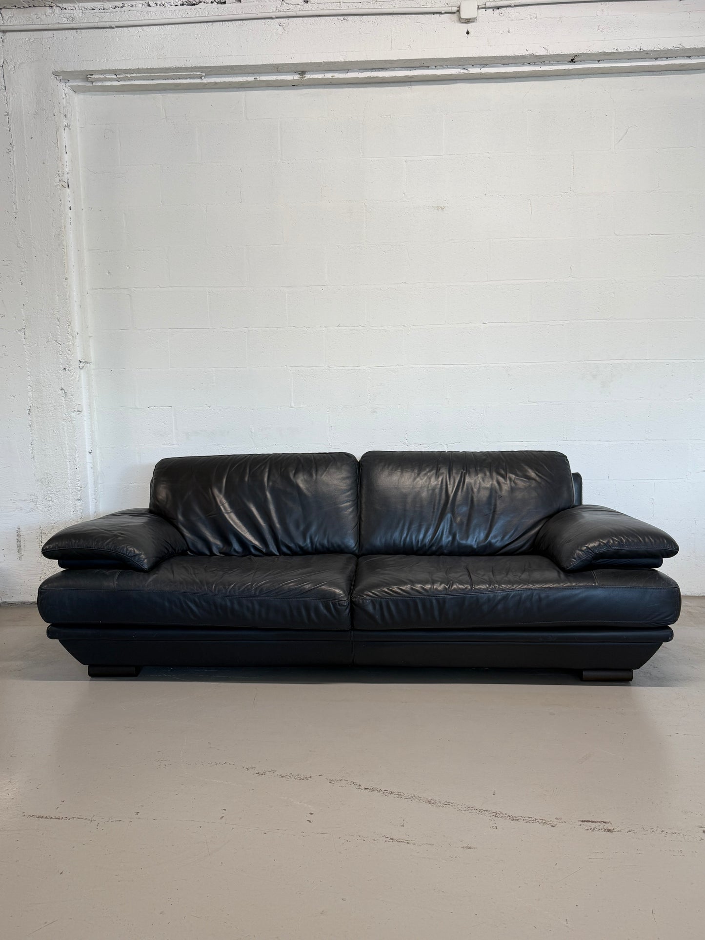 Natuzzi navy blue leather 3-seater sofa