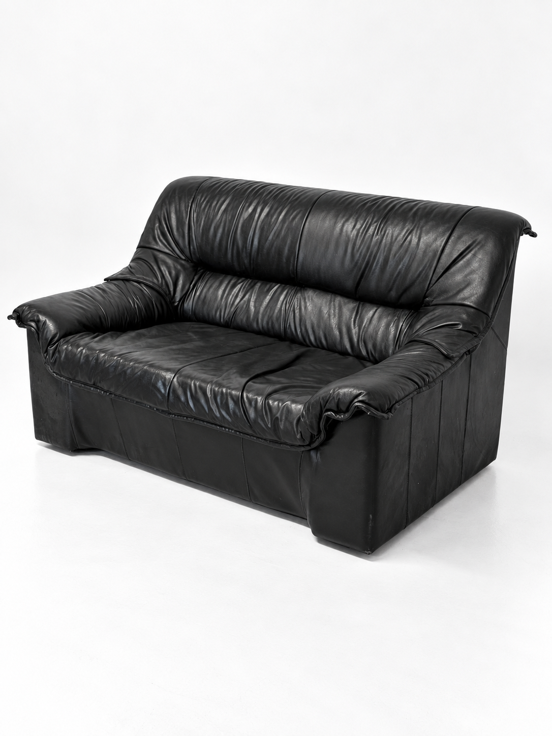 Black leather two-seater sofa, other side view