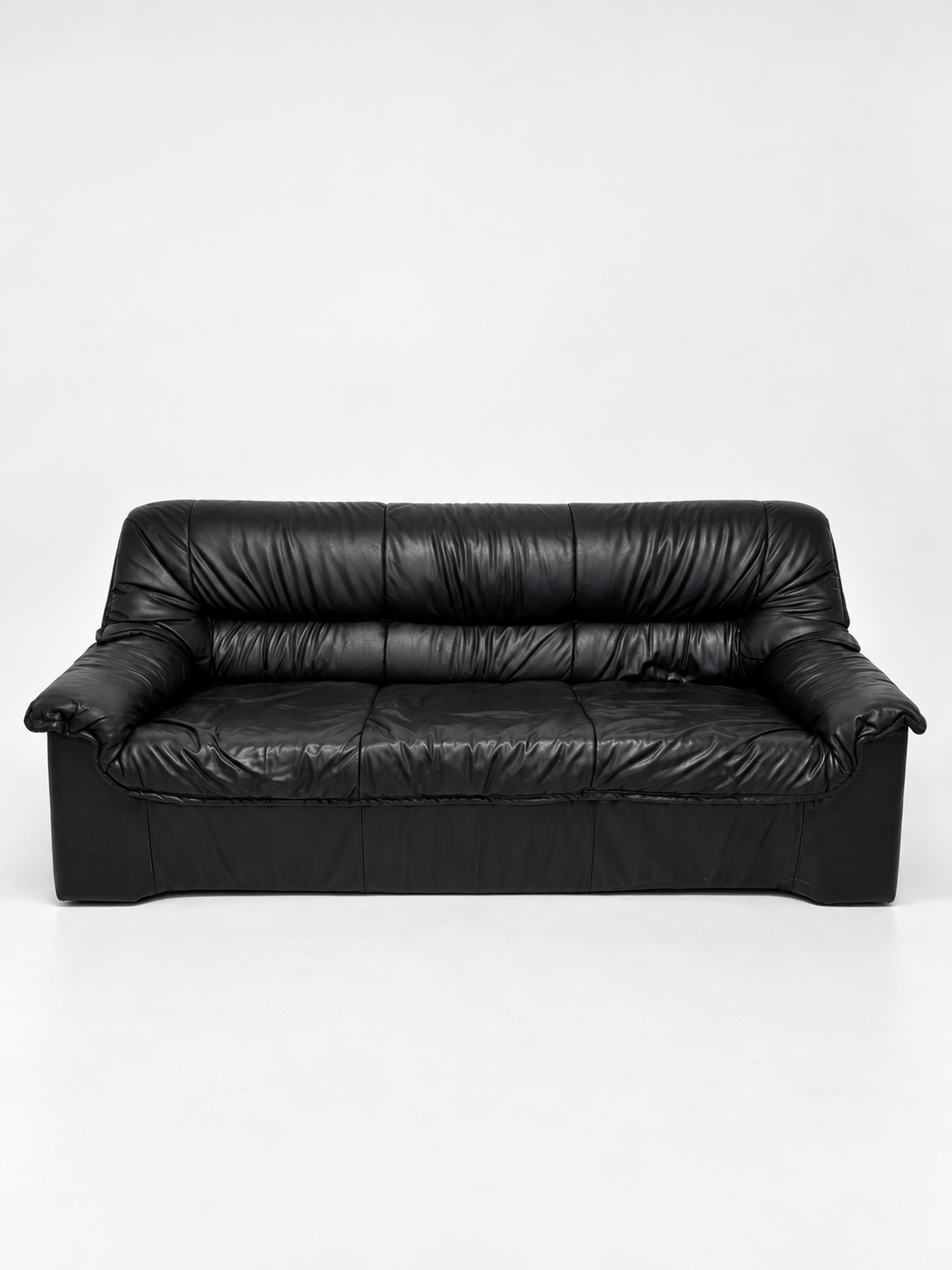 Black leather three-seater sofa, 1980s, front view