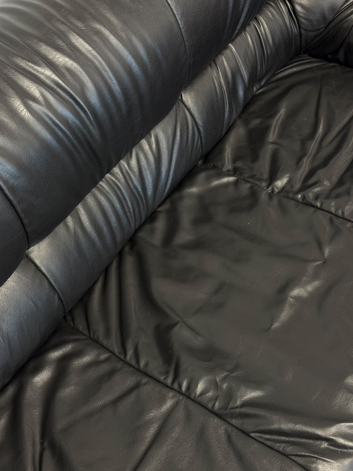 Black leather sofa, leather close-up
